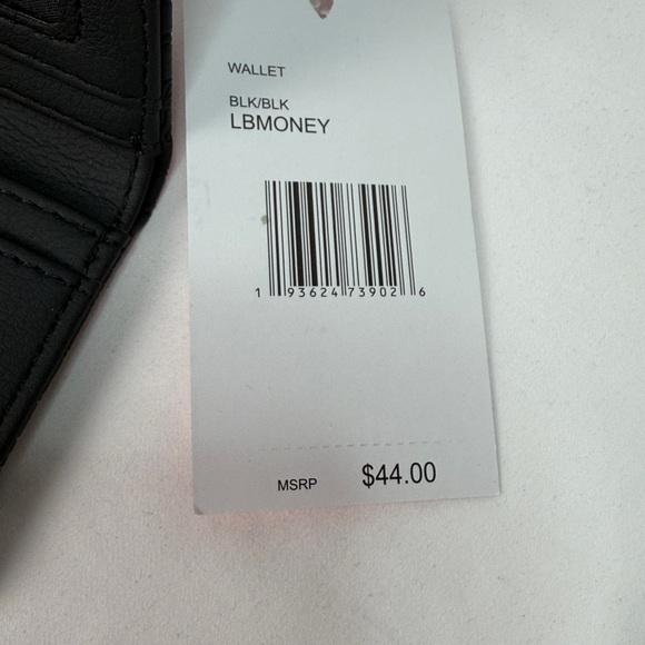 Betsey Johnson Snap Flap French Wallet in black with a heart and bow pattern. - Picture 7 of 7